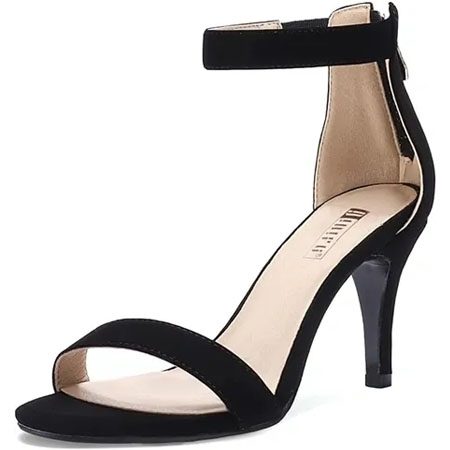 A black high heel sandal with ankle strap.