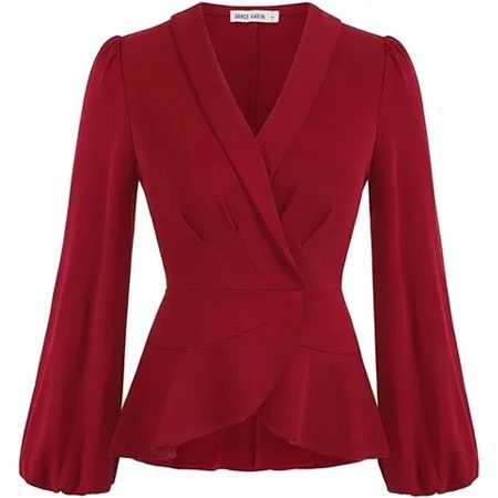 A red blouse with long sleeves and a peplum.