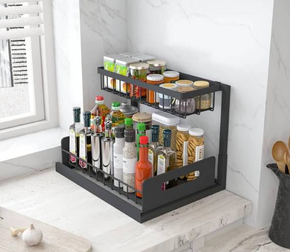 A black spice rack with spices and condiments on it.