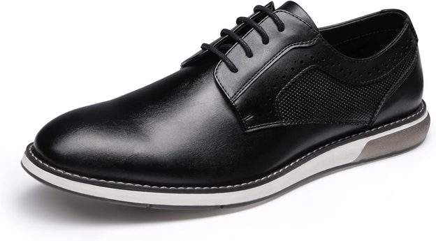 A black shoe with white sole and black leather upper.