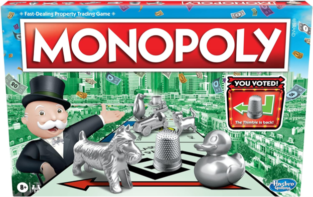 A monopoly game box with silver pieces and a man.