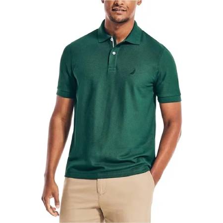 A man wearing a green polo shirt and khaki pants.